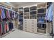 Spacious walk-in closet with ample storage, shelving, and custom organization systems at 16824 Ashton Oaks Dr, Charlotte, NC 28278