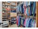 Organized walk-in closet with shelves and hanging rods for ample storage at 16824 Ashton Oaks Dr, Charlotte, NC 28278