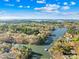 Expansive aerial view showcasing waterfront property with lush trees and beautiful lake views at 171 Agnew Rd, Mooresville, NC 28117