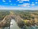 Breathtaking aerial view of the peninsula with water front homes surrounded by mature trees at 171 Agnew Rd, Mooresville, NC 28117