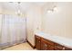 Cozy bathroom with traditional fixtures, including a shower/tub combination, vanity, and sconce lighting at 171 Agnew Rd, Mooresville, NC 28117