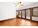 Spacious bedroom featuring hardwood floors, neutral walls, and outdoor access to the deck at 171 Agnew Rd, Mooresville, NC 28117