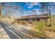 Charming brick ranch home with a spacious driveway and a cozy wooden fence at 171 Agnew Rd, Mooresville, NC 28117