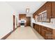 Traditional-style kitchen featuring wood cabinetry, white countertops, and modern appliances at 171 Agnew Rd, Mooresville, NC 28117