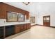 Bright kitchen with white countertops, wood cabinets, and a large window overlooking the yard at 171 Agnew Rd, Mooresville, NC 28117