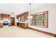 Well-lit kitchen featuring wood cabinets, white appliances, and a bay window with natural light at 171 Agnew Rd, Mooresville, NC 28117