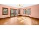 Light-filled living room boasts hardwood floors, bay window, and access to the outdoors at 171 Agnew Rd, Mooresville, NC 28117
