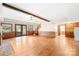 Expansive open floor plan with a fireplace, hardwood floors, and access to a backyard deck at 171 Agnew Rd, Mooresville, NC 28117