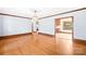Open living room leading into the kitchen, with hardwood floors and trim at 171 Agnew Rd, Mooresville, NC 28117