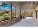 Covered patio with brick accents overlooking the lake at 171 Agnew Rd, Mooresville, NC 28117