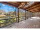 Screened-in porch with views of the lake surrounded by lush greenery at 171 Agnew Rd, Mooresville, NC 28117