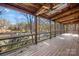 Screened-in porch with views of the lake surrounded by lush greenery at 171 Agnew Rd, Mooresville, NC 28117