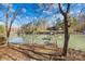 Scenic view of the tranquil lake with a private wooden dock at 171 Agnew Rd, Mooresville, NC 28117