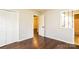 This bedroom features hardwood floors, neutral walls, natural light, and a closet with bifold doors at 1780 Lumpkin Cir, Rock Hill, SC 29732