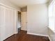 This cozy bedroom features hardwood floors, neutral walls, natural light, and a closet with bifold doors at 1780 Lumpkin Cir, Rock Hill, SC 29732