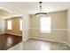 Inviting dining room with tile flooring, a modern light fixture, and easy access to other areas at 1780 Lumpkin Cir, Rock Hill, SC 29732