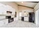 Modern kitchen featuring white cabinets, granite countertops, and stainless steel appliances at 1780 Lumpkin Cir, Rock Hill, SC 29732