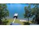 Stunning aerial view of the property with a private dock, boat lift, and fire pit at 180 Willow Point Rd, Troutman, NC 28166