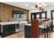 Finished basement with a bar, wood accent wall, and modern finishes at 180 Willow Point Rd, Troutman, NC 28166