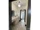 Bright bathroom with double vanity, patterned floor, and a view into a tiled shower area at 180 Willow Point Rd, Troutman, NC 28166