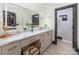 Bright bathroom featuring a vanity with great storage, a big mirror, and natural light at 180 Willow Point Rd, Troutman, NC 28166