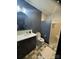 Modern bathroom showcasing a sleek vanity, frameless shower, and unique tiling for a luxurious feel at 180 Willow Point Rd, Troutman, NC 28166