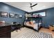 Blue bedroom featuring a bunk bed, modern décor, natural light, and a ceiling fan at 180 Willow Point Rd, Troutman, NC 28166
