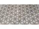 Detailed shot of the tiled floor with a decorative flower pattern in neutral colors at 180 Willow Point Rd, Troutman, NC 28166