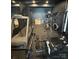 Private gym with various equipment for a full body workout, including a treadmill and weight machines at 180 Willow Point Rd, Troutman, NC 28166