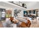 Spacious living room with view of modern kitchen and dining area, with access to the backyard at 180 Willow Point Rd, Troutman, NC 28166
