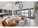 Bright living room with lake views, high ceilings, and modern furniture at 180 Willow Point Rd, Troutman, NC 28166