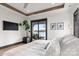 Comfortable main bedroom offering lake views, wooden beams, and stylish furnishings at 180 Willow Point Rd, Troutman, NC 28166