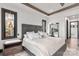 Elegant main bedroom with lake views, a designer headboard, and sophisticated lighting at 180 Willow Point Rd, Troutman, NC 28166