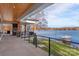 Expansive outdoor patio with a grill and lake views, ideal for entertaining and relaxation at 180 Willow Point Rd, Troutman, NC 28166