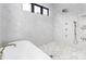 This pristine shower has marble walls, decorative trim, a window, and multiple shower heads at 180 Willow Point Rd, Troutman, NC 28166