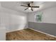 Bedroom features wood floors, white walls, a ceiling fan and a window view of the outdoors at 1888 Usher Rd, Lancaster, SC 29720