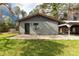 Shows a side of the house, highlighted by gray siding and a covered parking area at 1888 Usher Rd, Lancaster, SC 29720