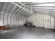 Spacious garage interior with metal siding, concrete floor and ample storage space at 1888 Usher Rd, Lancaster, SC 29720