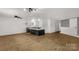 Open-concept living room features wood floors and brick bar, offering ample space at 1888 Usher Rd, Lancaster, SC 29720