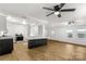 Open-concept living room with modern lighting and access to the kitchen at 1888 Usher Rd, Lancaster, SC 29720