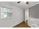 Room features a window view of the outdoors, grey wainscoting, wood floors, and built-in shelving at 1888 Usher Rd, Lancaster, SC 29720