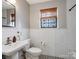 Bathroom featuring black and white tile, subway tile, and stylish fixtures at 199 Ingleside Se Dr, Concord, NC 28025