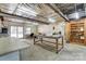 Inside the garage reveals slatwall, fluorescent lighting, and space for projects at 211 Spring St, Belmont, NC 28012