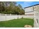 Spacious backyard features a well-maintained lawn and white picket fence at 2125 Shenandoah Ave, Charlotte, NC 28205