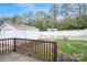 View of the backyard with a white picket fence, pergola, and well-maintained lawn at 2125 Shenandoah Ave, Charlotte, NC 28205
