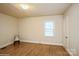 An empty bedroom has hardwood floors and lots of natural light at 2125 Shenandoah Ave, Charlotte, NC 28205