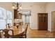 Dining room view showcasing hardwood floors and wooden furnishings at 2125 Shenandoah Ave, Charlotte, NC 28205