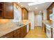 Kitchen featuring granite countertops, wooden cabinets, and stainless steel appliances at 2125 Shenandoah Ave, Charlotte, NC 28205