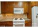 Close-up of kitchen appliances and granite countertops at 2125 Shenandoah Ave, Charlotte, NC 28205
