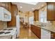 Kitchen featuring granite countertops, wooden cabinets, and a skylight at 2125 Shenandoah Ave, Charlotte, NC 28205
